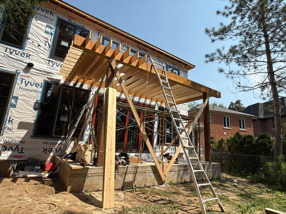 Rear balcony cantilever framing