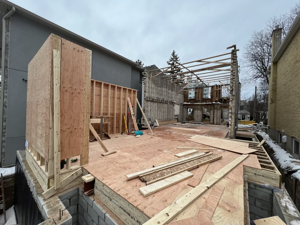 Structural deck and floor framing on foundation