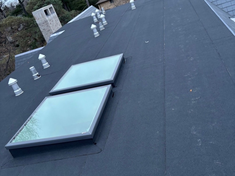 Flat roof with two skylights installed