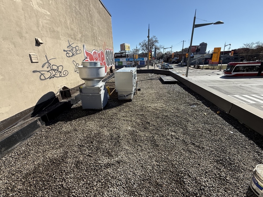 Commercial flat gravel roof on Toronto street corner